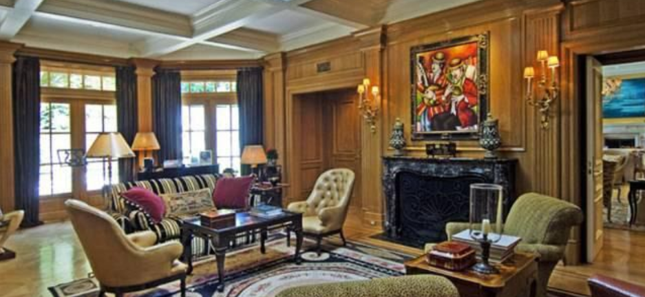 A living room filled with furniture and a fireplace.