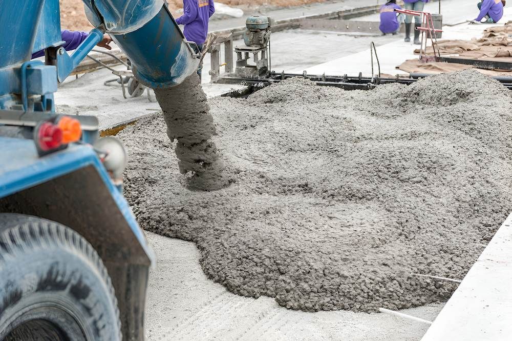 A Truck is Pouring Concrete on a Construction Site — Nicks Readymix in Imbil, QLD