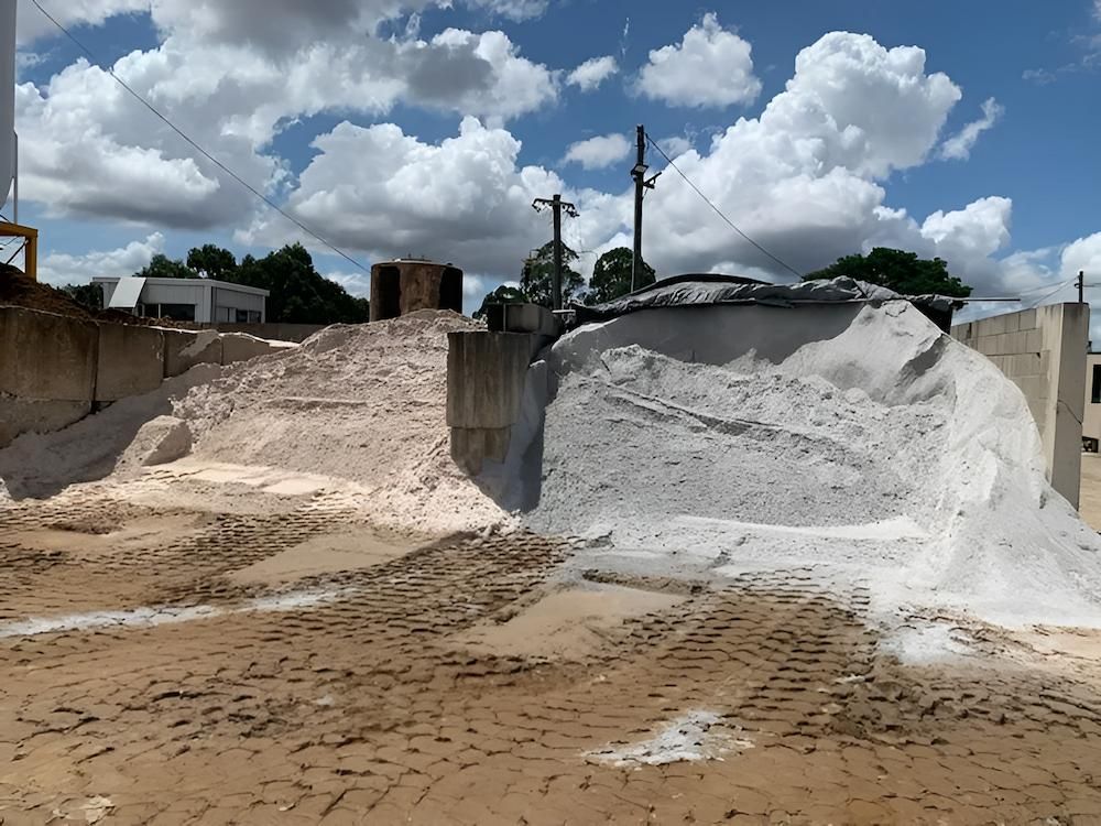 A Pile of White Sand is Sitting on Top of a Dirt Field — Nicks Readymix in Poona, QLD