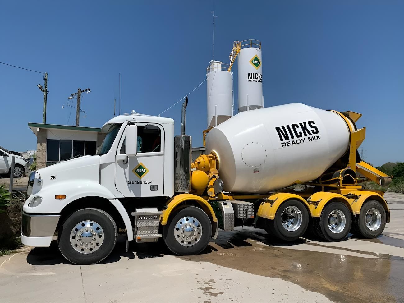 A Concrete Mixer Truck is Parked in Front of a Concrete Plant — Nicks Readymix in Cooroy, QLD