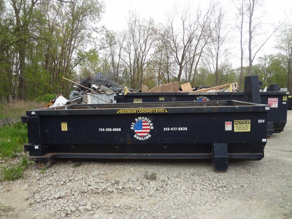All American Hauling Dumpsters With Junks in It