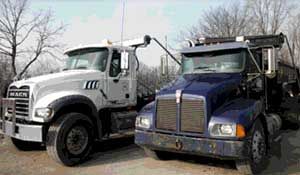 Two Dumpster Trucks