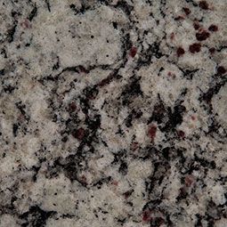Close-up of speckled gray granite with black, white, and dark red flecks