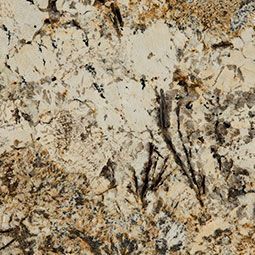 Close-up of beige and brown speckled stone or granite texture with dark veining