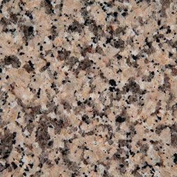 Pink and black speckled granite surface texture