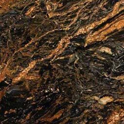 Close-up of dark brown and black stone with gold and tan veining.