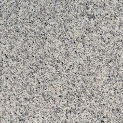 Gray speckled granite surface with a fine grain pattern