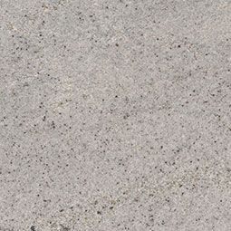 Close-up of a light gray speckled concrete surface