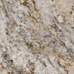 Close-up of light gray granite with tan and white speckled texture