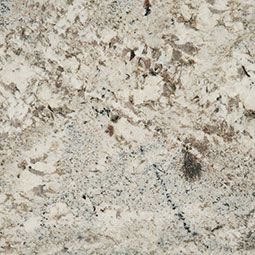Speckled beige and gray stone surface with subtle brown flecks and dark veins
