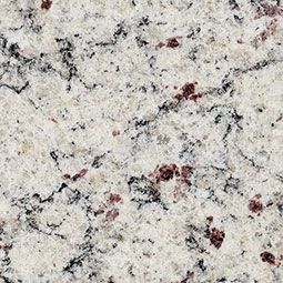 Close-up of light speckled granite countertop with black, gray, and burgundy flecks