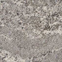 Gray speckled stone or granite surface with a rough, mottled texture