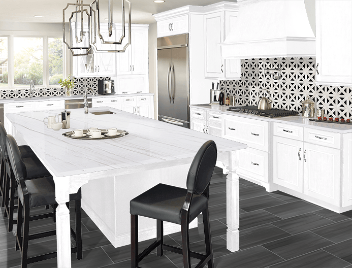 Bright white kitchen with island, black chairs, patterned tile backsplash, and stainless steel fridge
