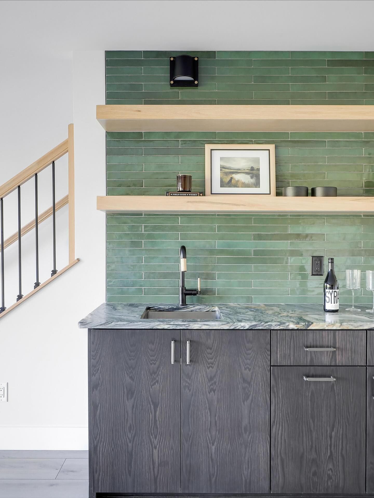 Modern kitchen with blue cabinets, wood islands, and stainless steel appliances