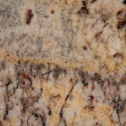 Close-up of speckled beige, gray, and brown granite stone surface