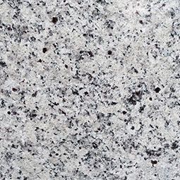 Light gray speckled stone surface with black and white flecks