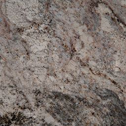 Close-up of speckled gray and pink granite with dark veining