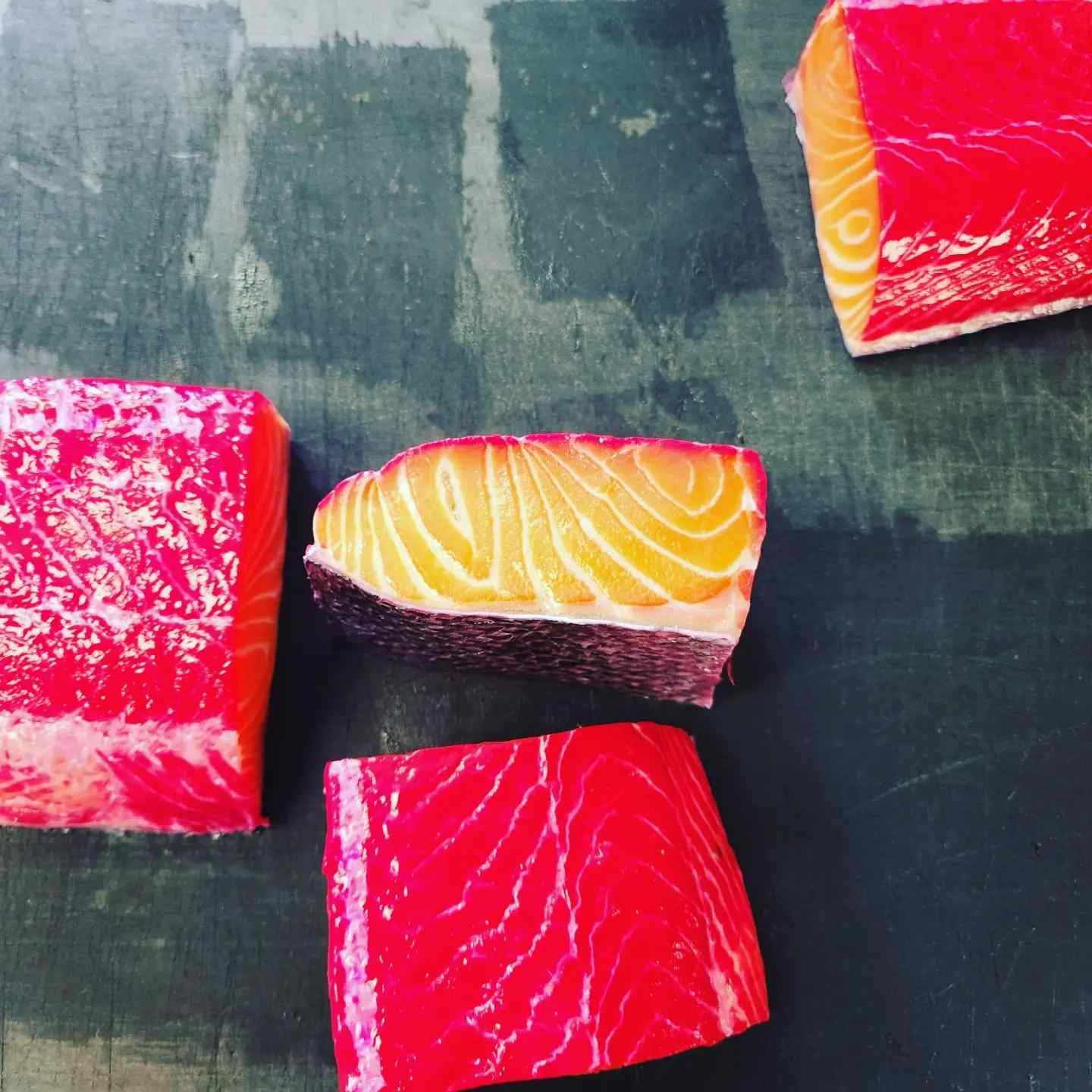 A close up of slices of salmon on a table