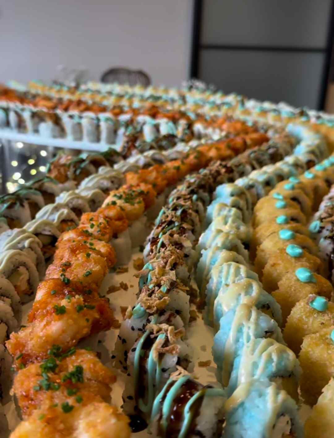 There are many different types of sushi on the table.
