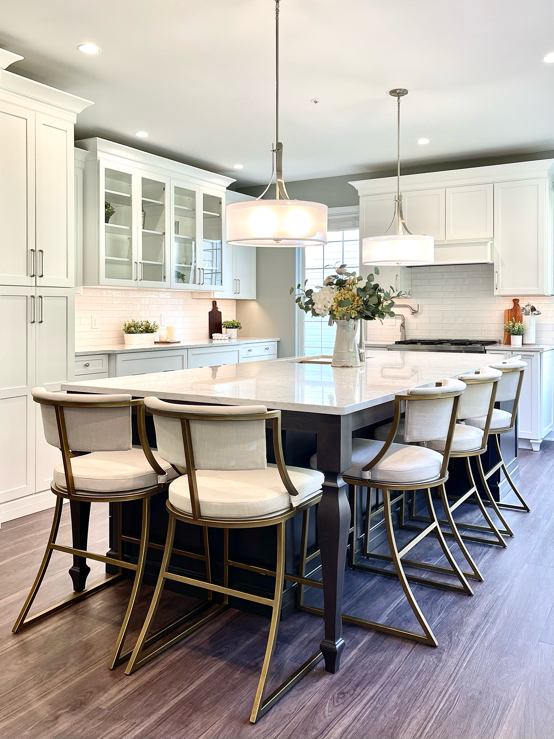 A kitchen with a table and chairs in it