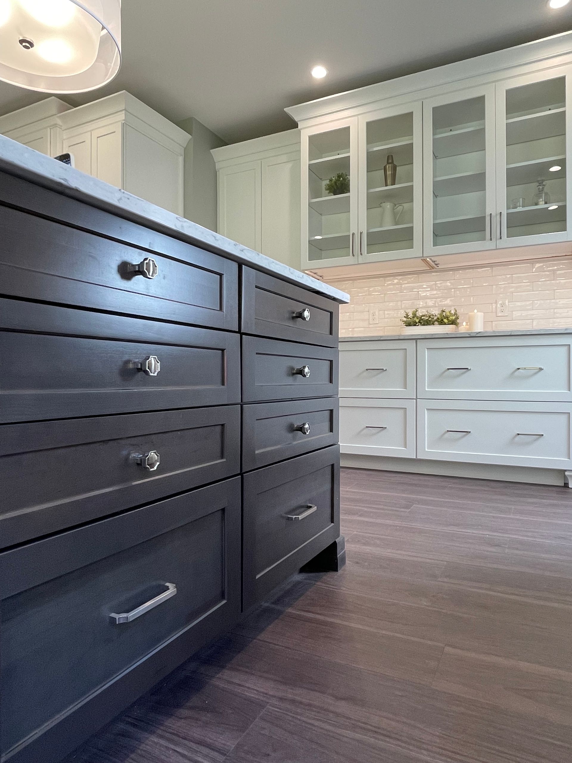 A kitchen with a lot of drawers and cabinets