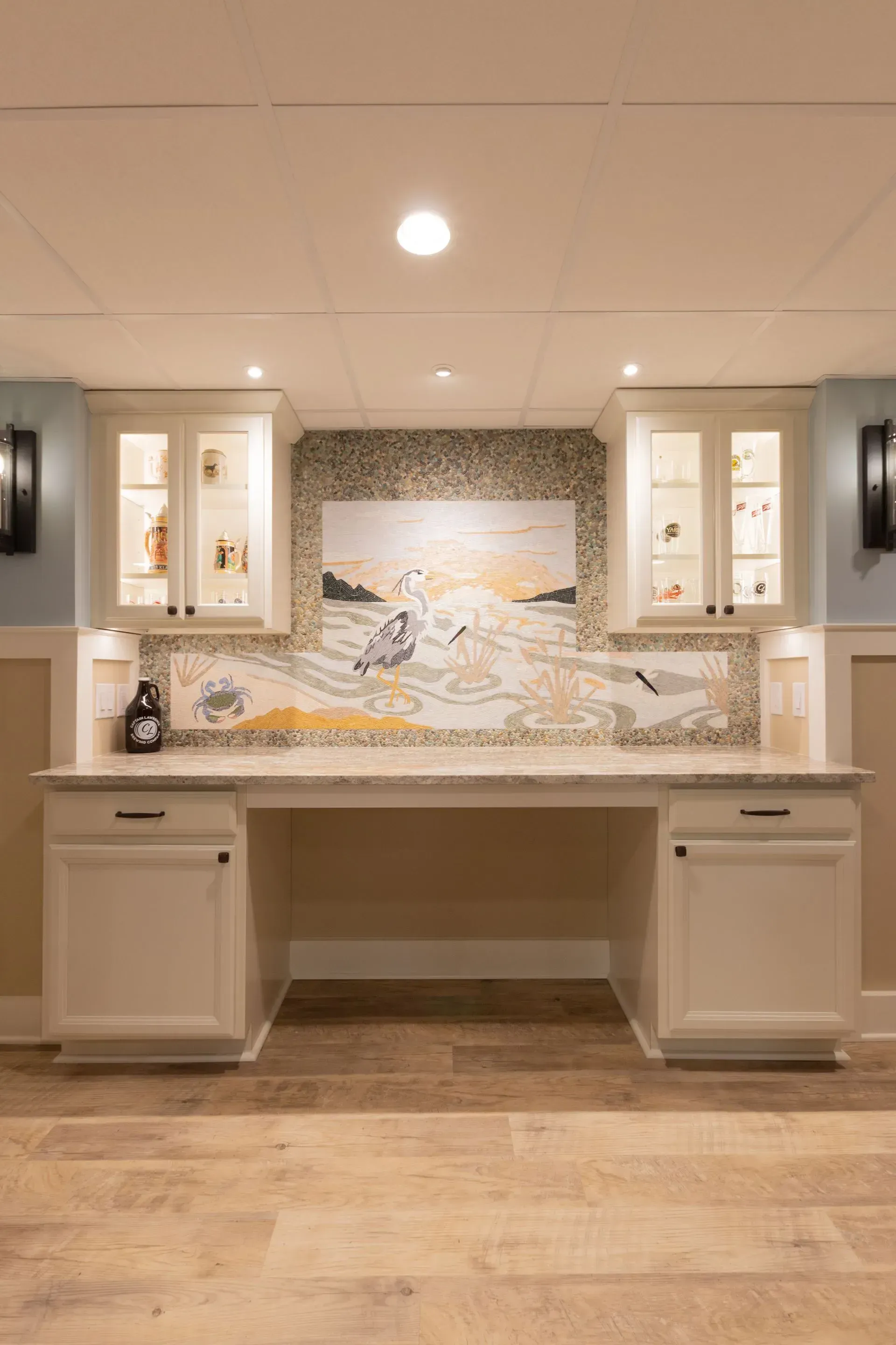 There is a painting on the wall above the desk in the room.