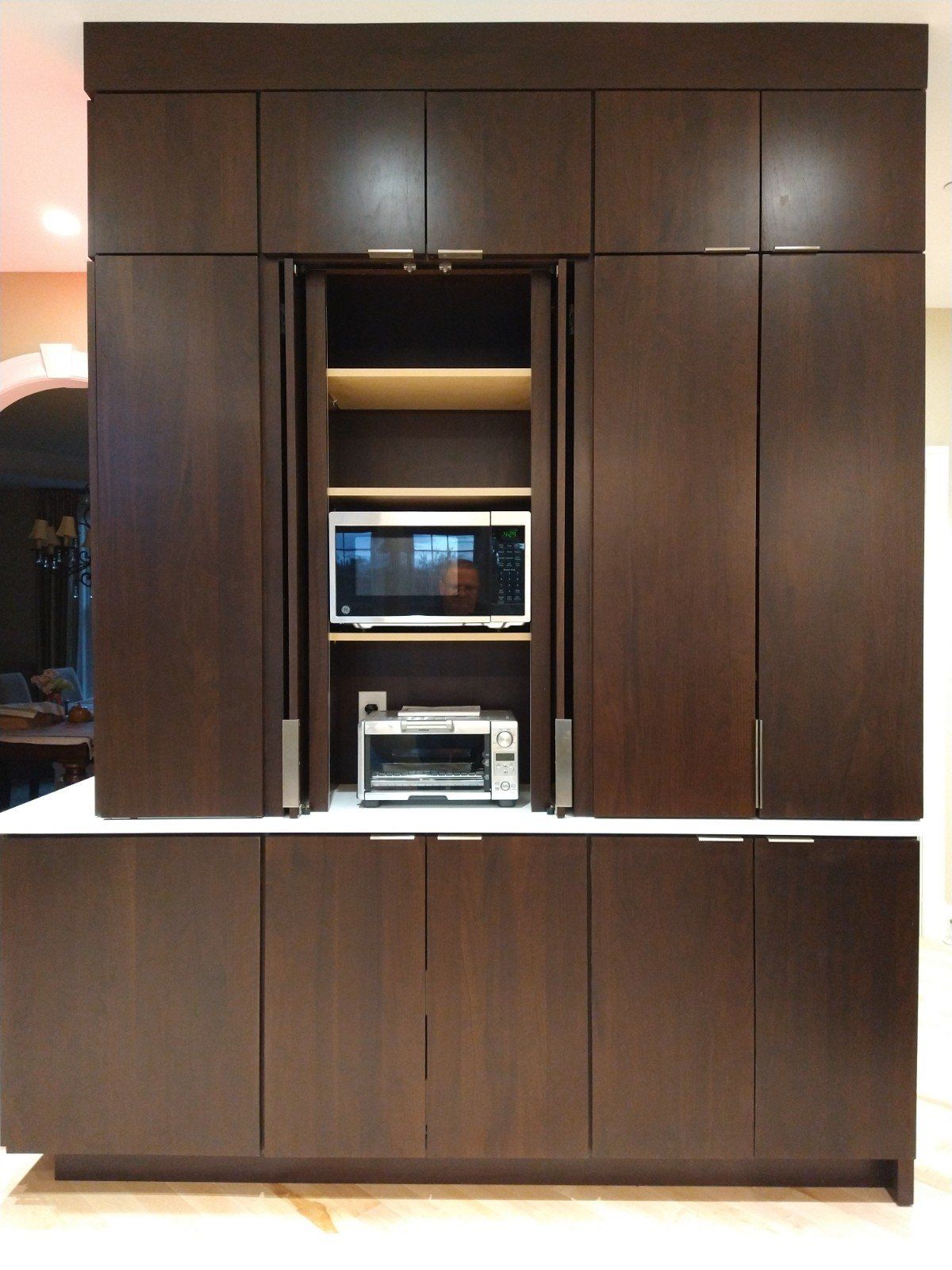 A kitchen with a microwave and a toaster oven