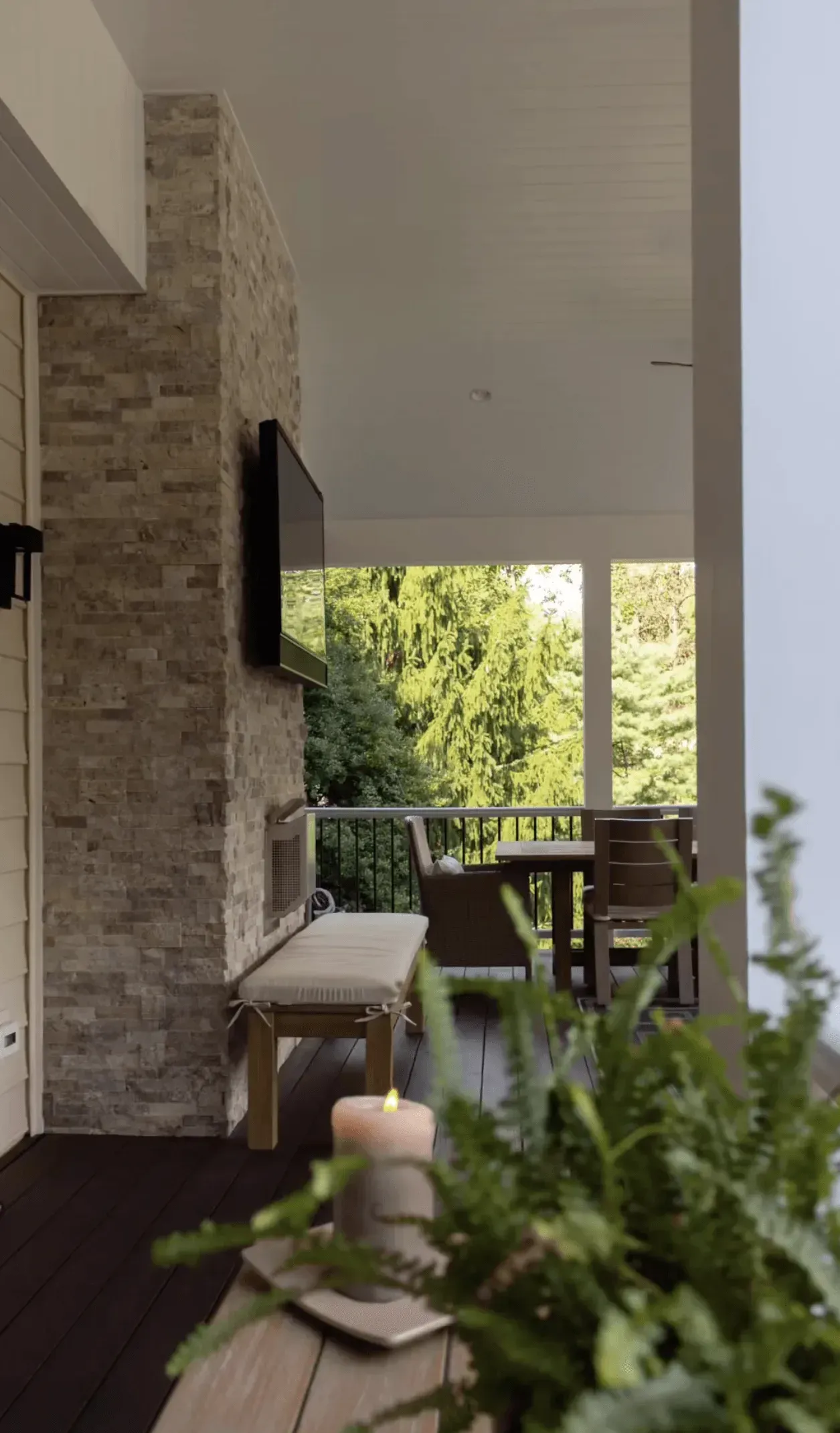 A candle is sitting on a table in a living room.