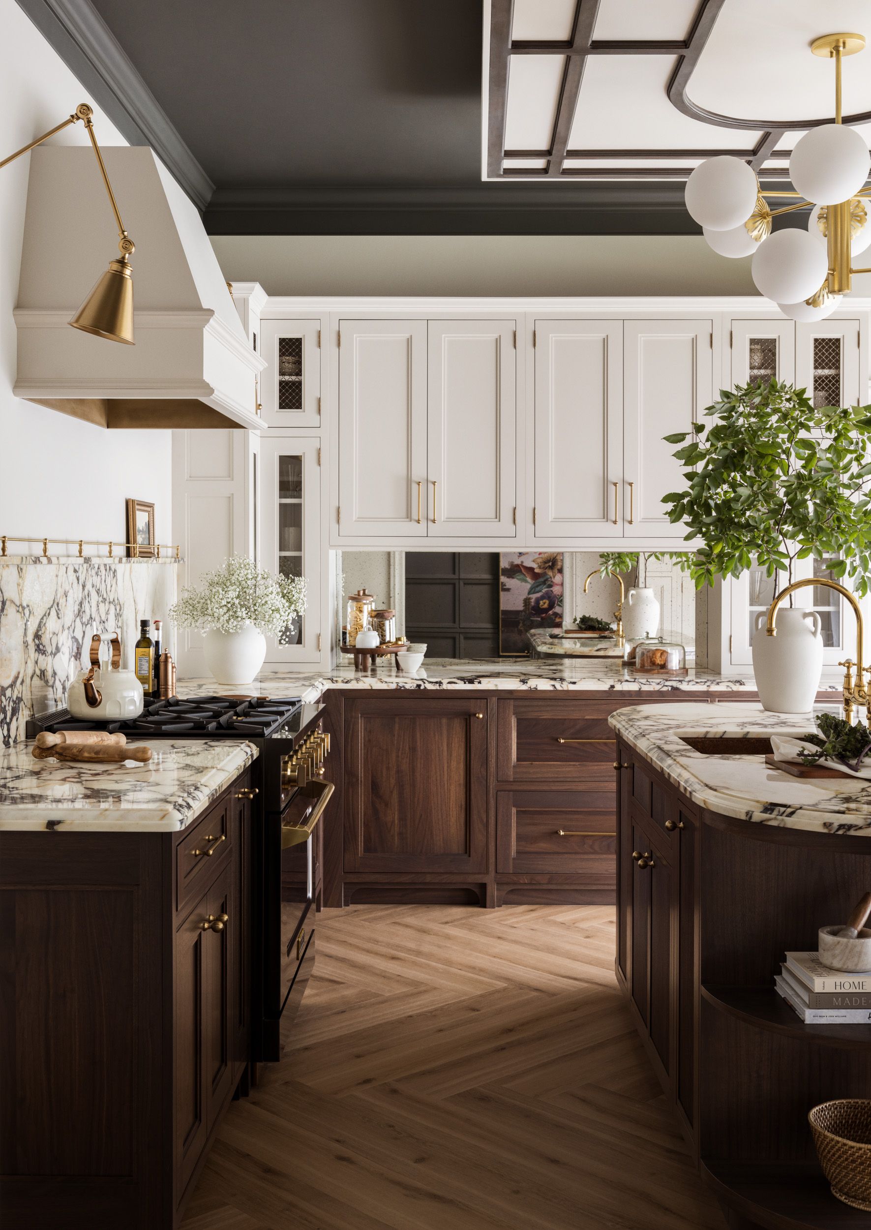 A kitchen with white cabinets , wooden cabinets , a stove and a sink.