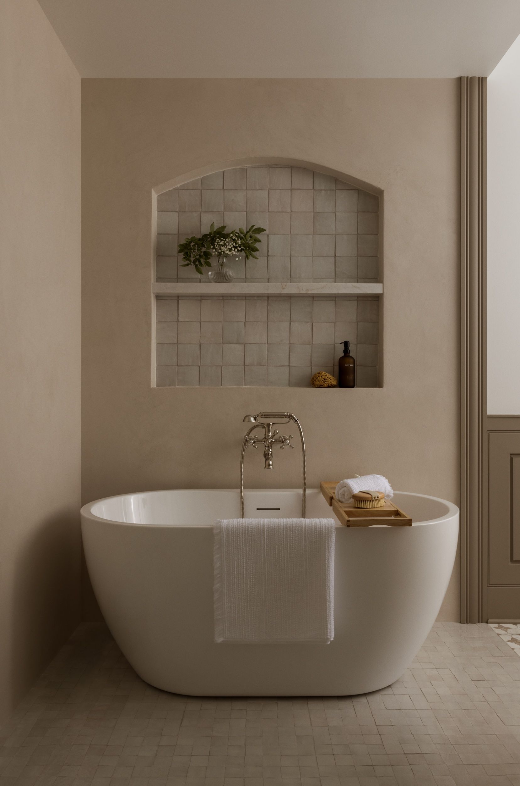 There is a bathtub in the middle of the bathroom.