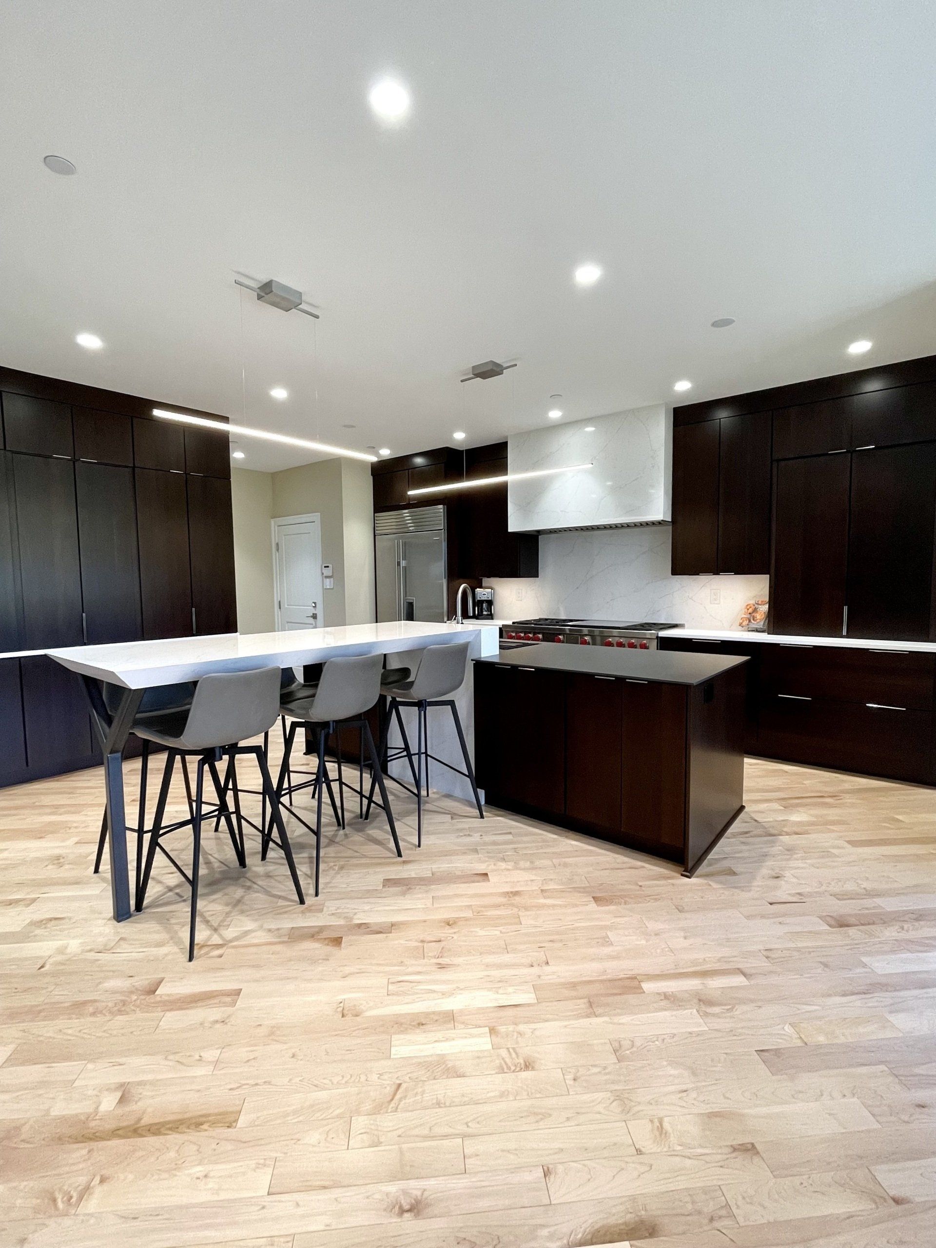 A kitchen with a table and chairs in it