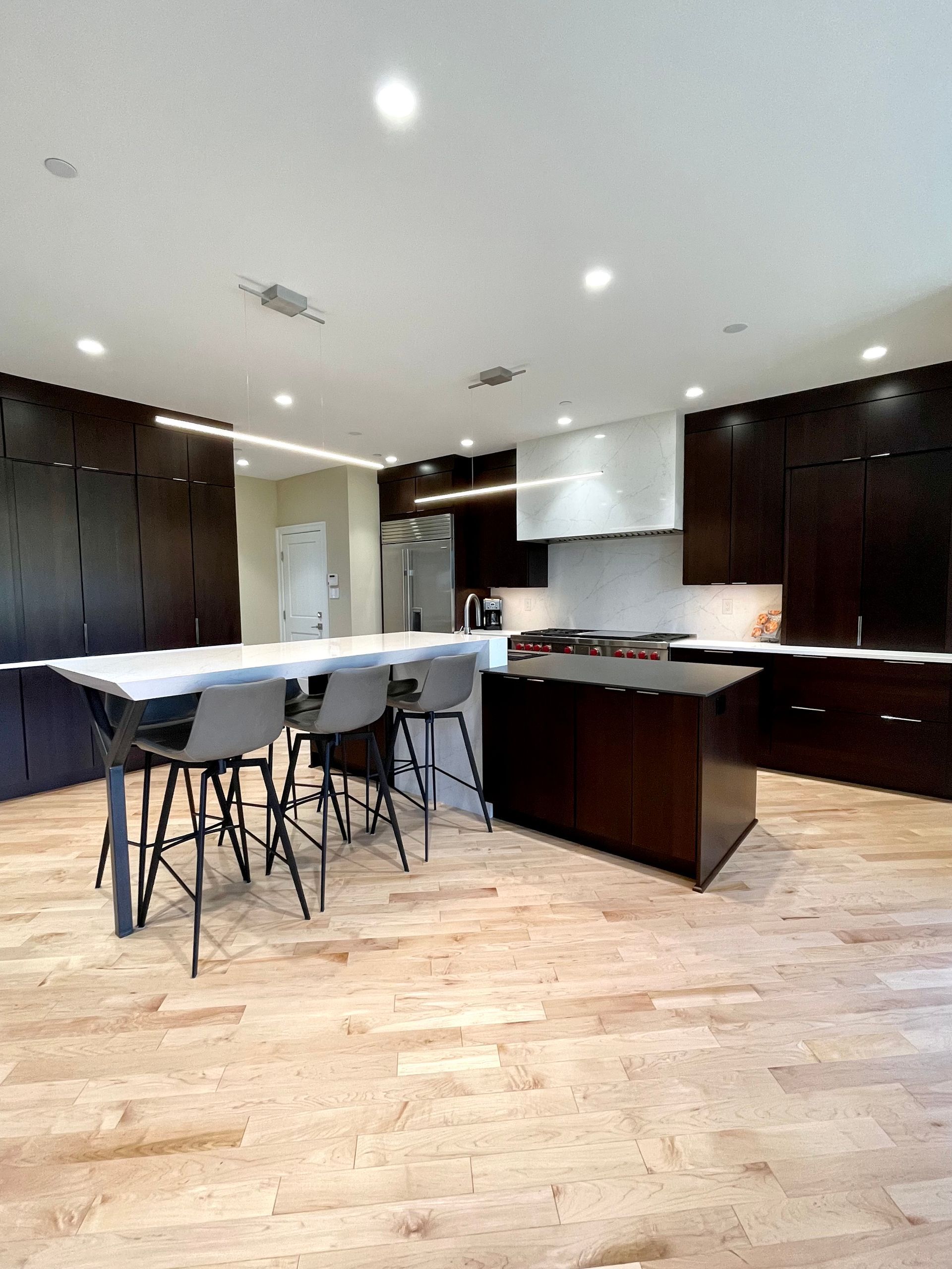 A kitchen with a table and chairs in it