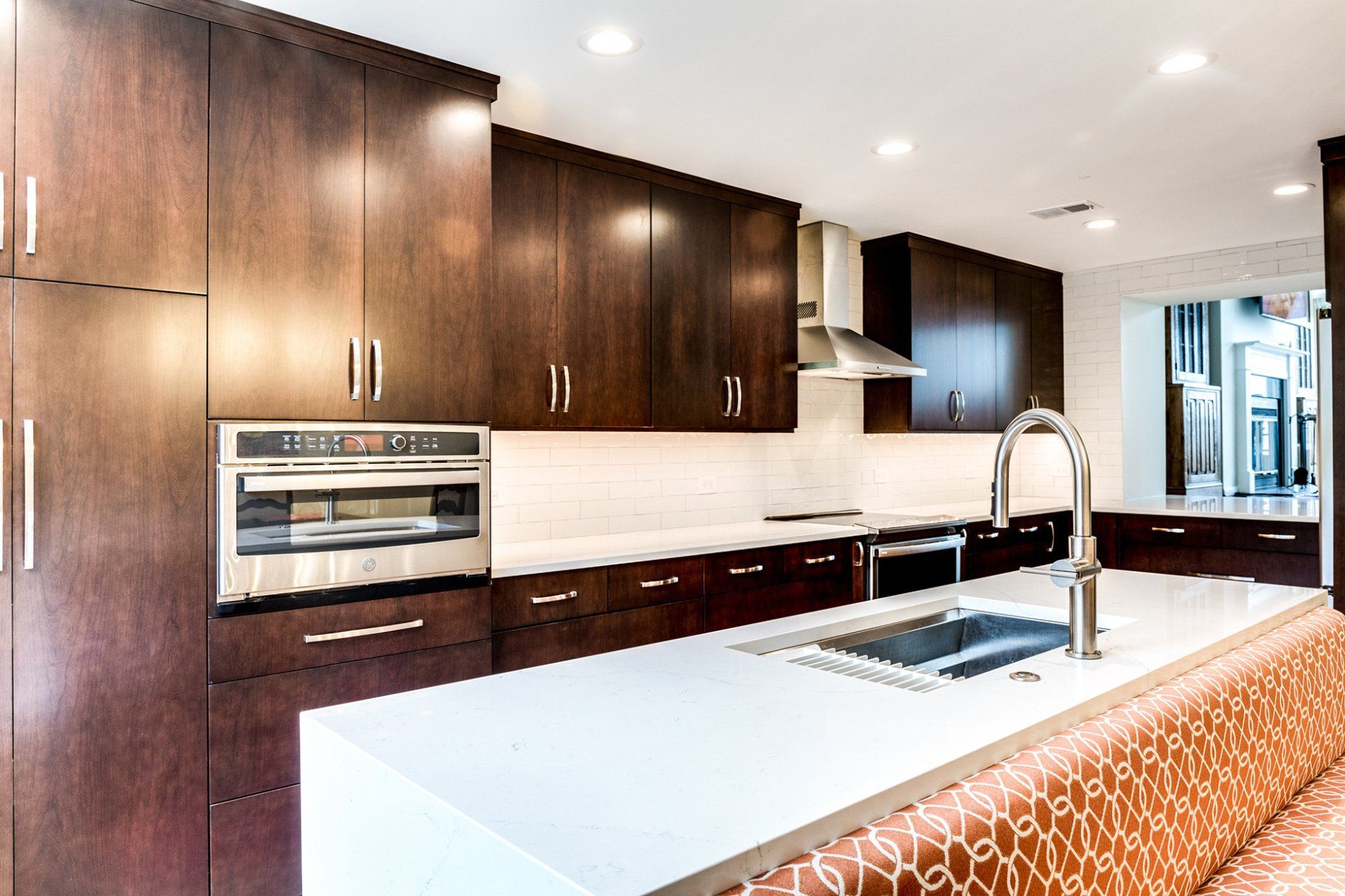 A kitchen with stainless steel appliances and wooden cabinets