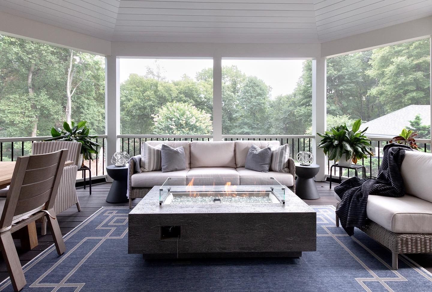 There is a fire pit in the middle of the living room.