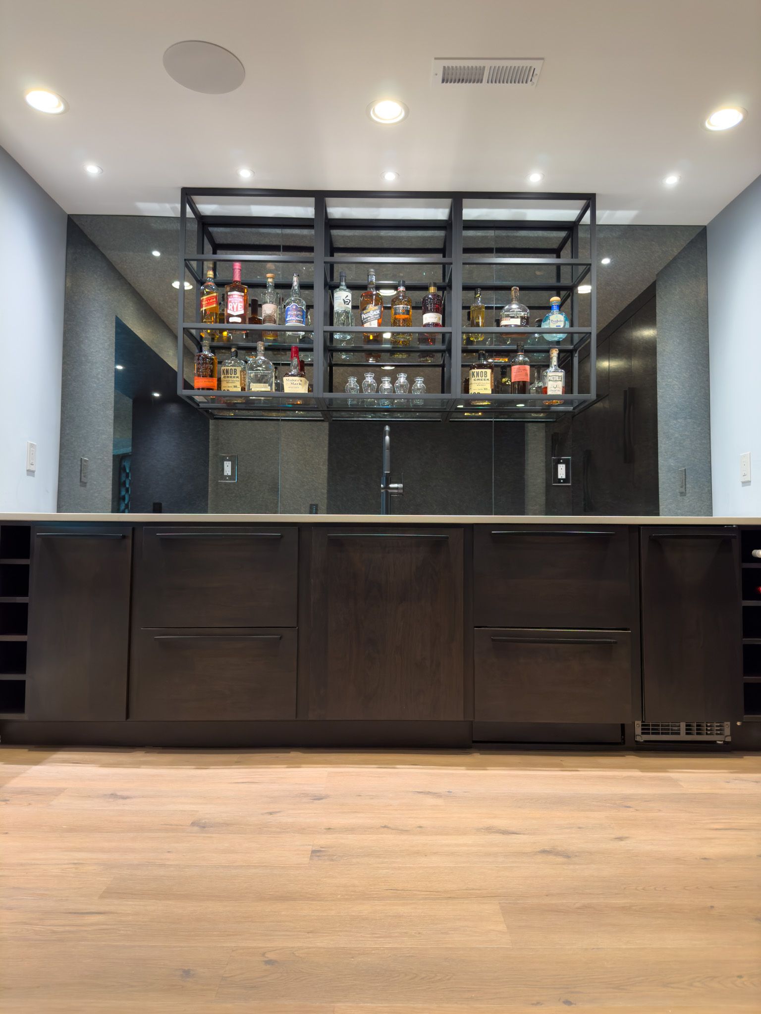 A bar with a lot of bottles on it