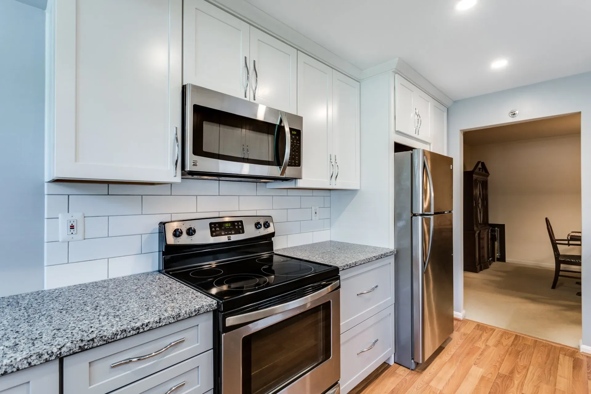 A kitchen with stainless steel appliances and granite counter tops