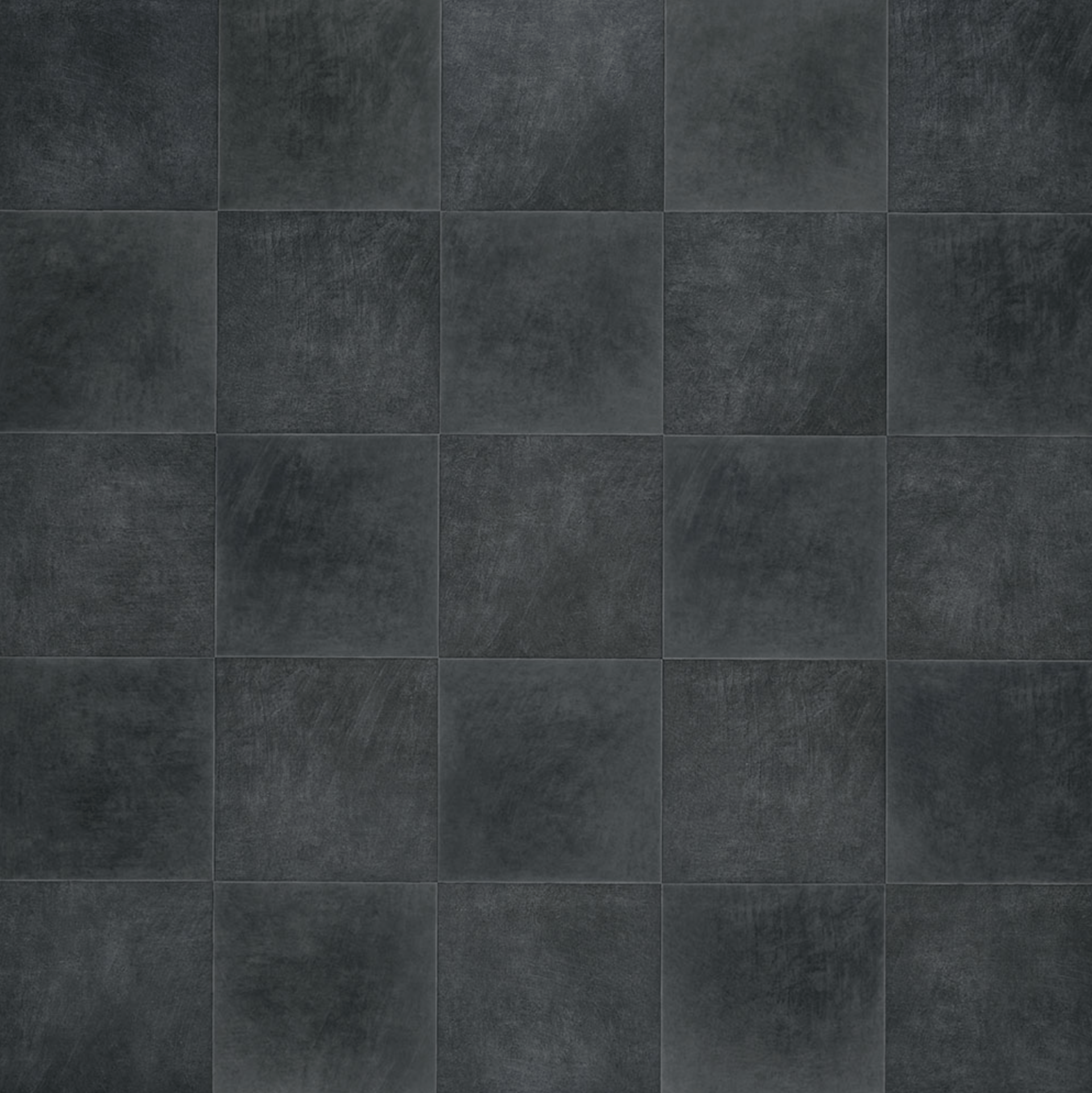 A close up of a black tile floor.