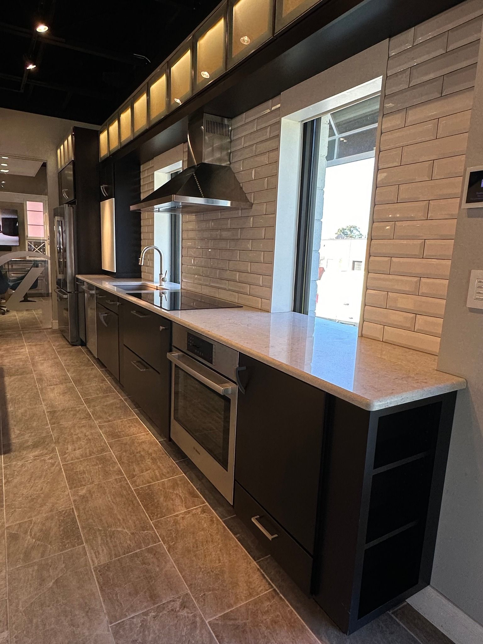 A kitchen with a lot of cabinets and appliances