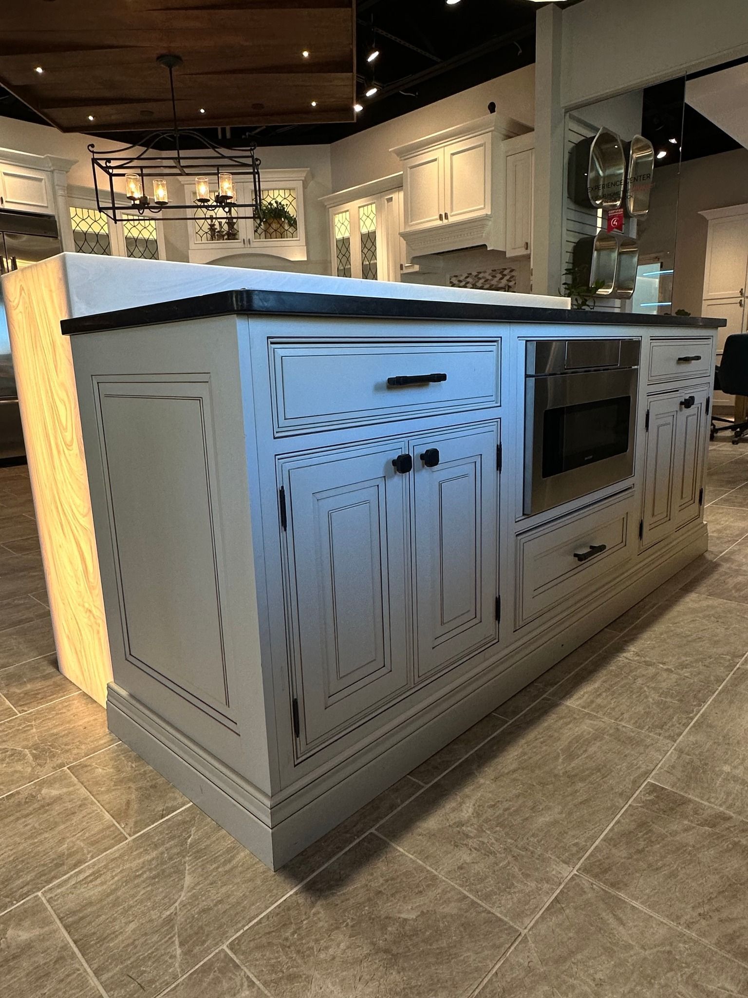 A kitchen with a large island in the middle of the room.