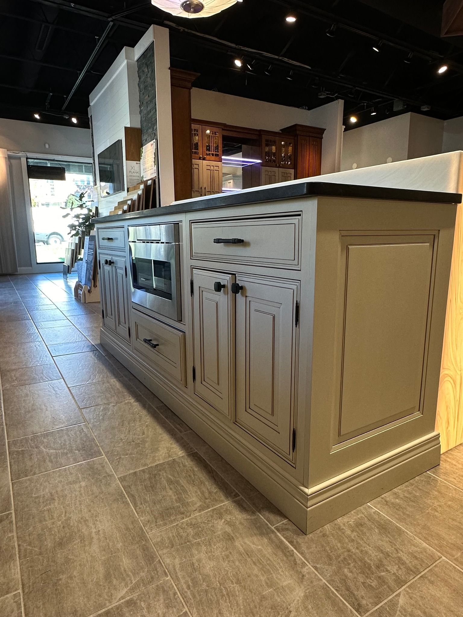 A kitchen with a large island in the middle of the room.