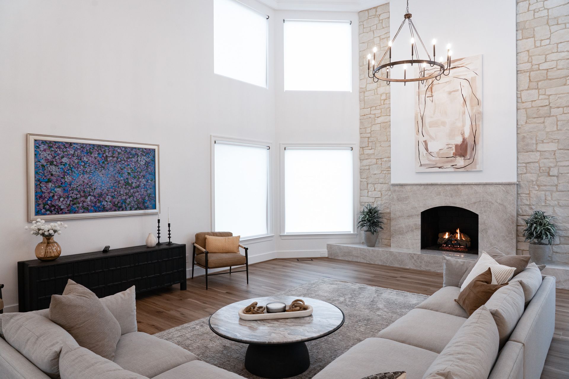 A living room filled with furniture and a fireplace.