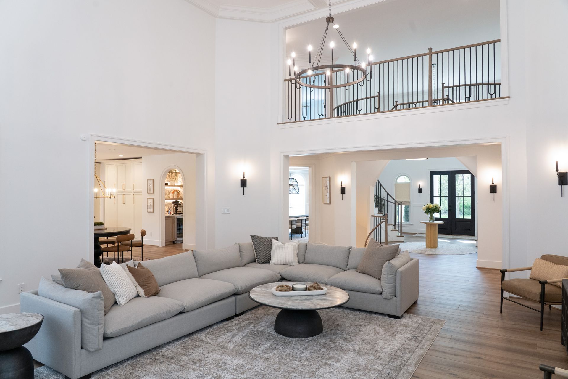A living room with a large sectional couch and a coffee table.