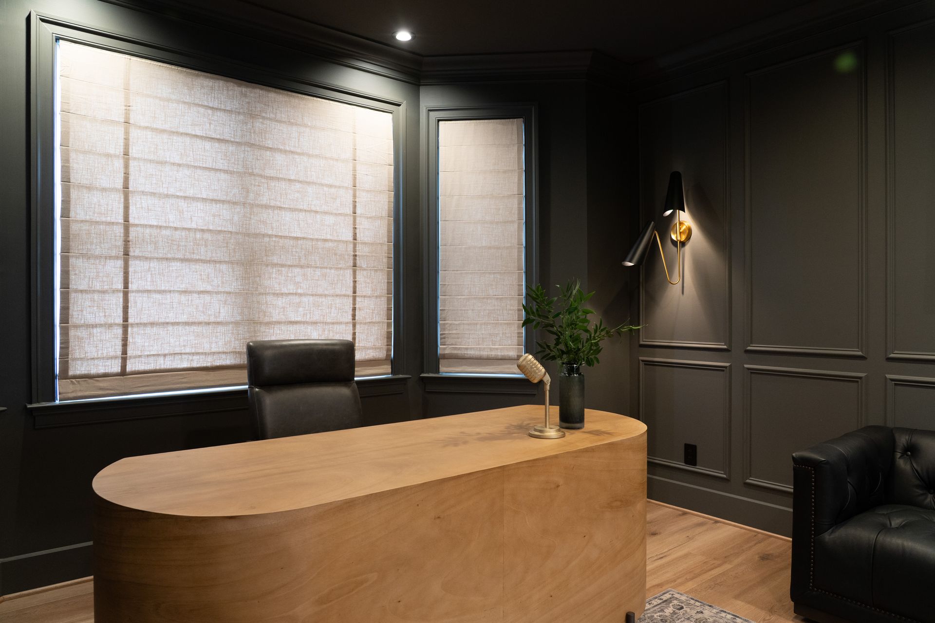 There is a wooden desk in the middle of the room.