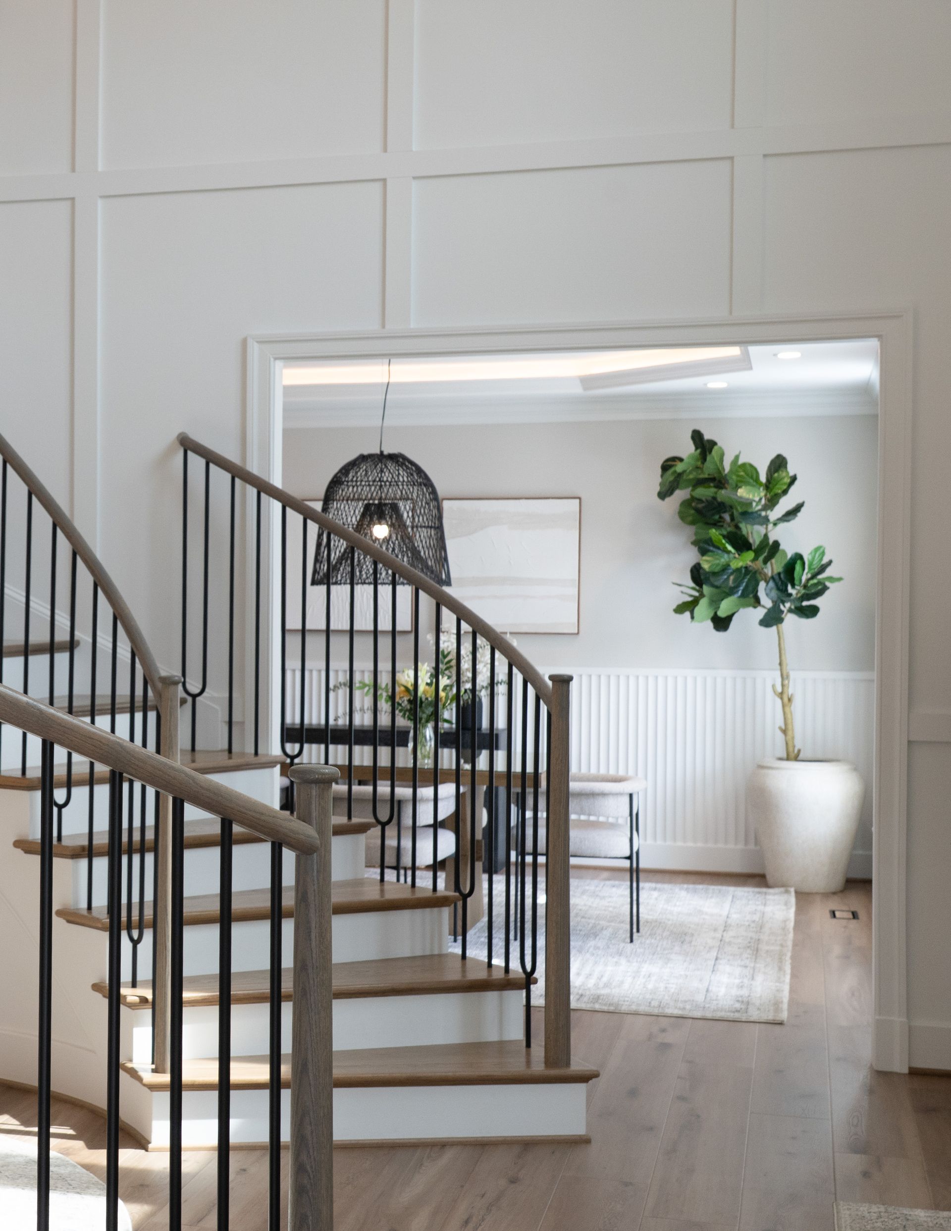 A staircase leading up to a living room in a house