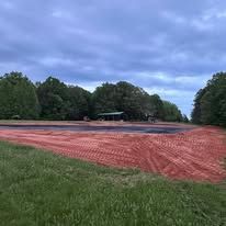 There is a lot of dirt in the middle of the field.