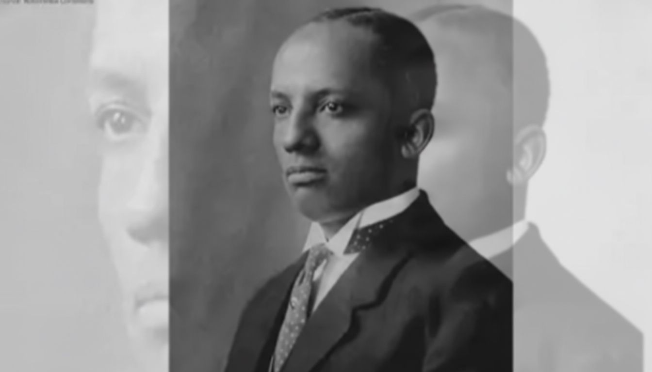Family, diverse in appearance, joins hands in a park, smiling.