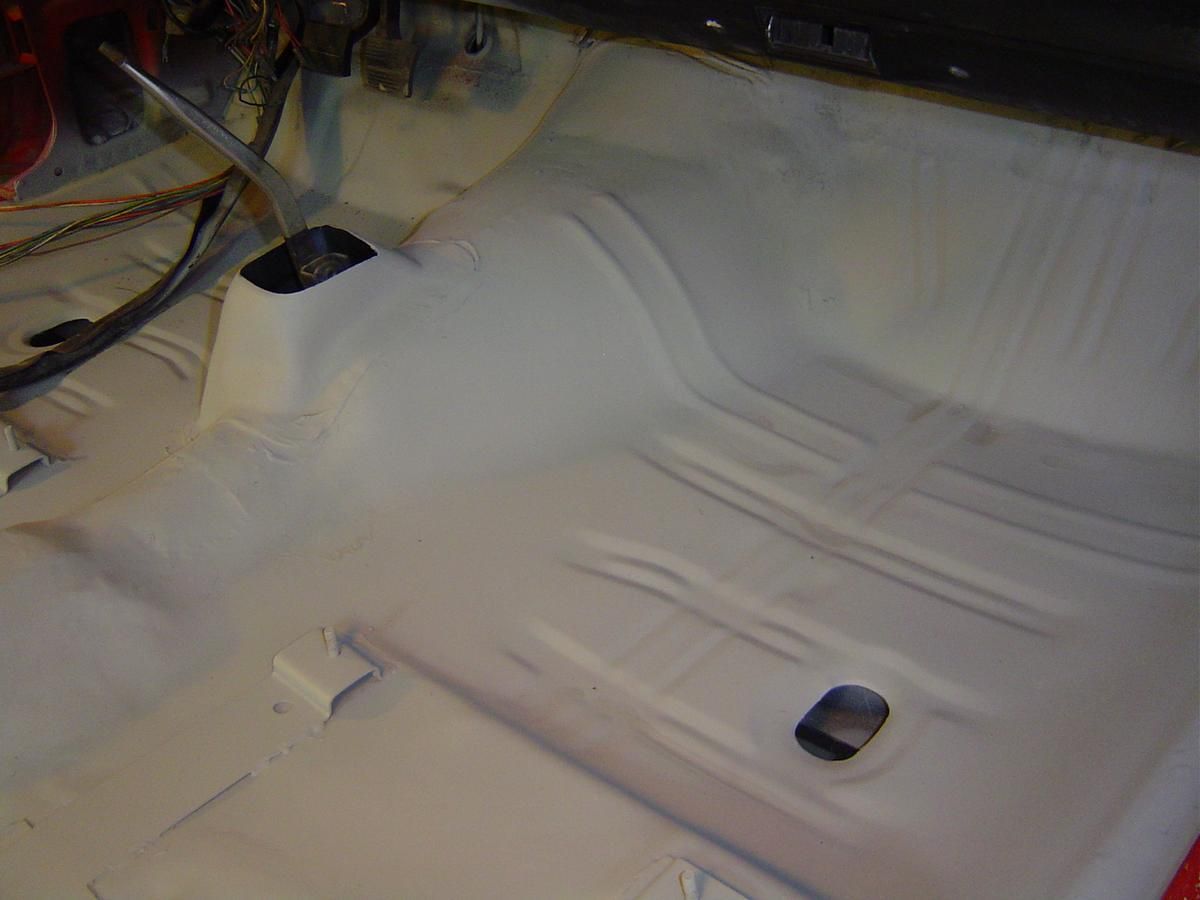 The inside of a car is being painted white.