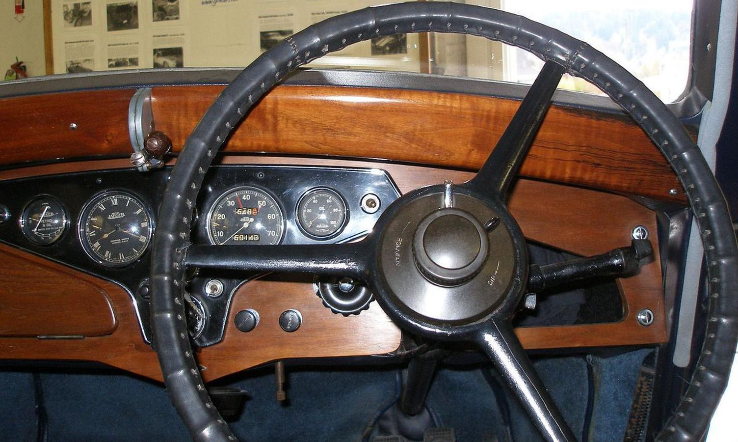 A close up of a steering wheel in a car