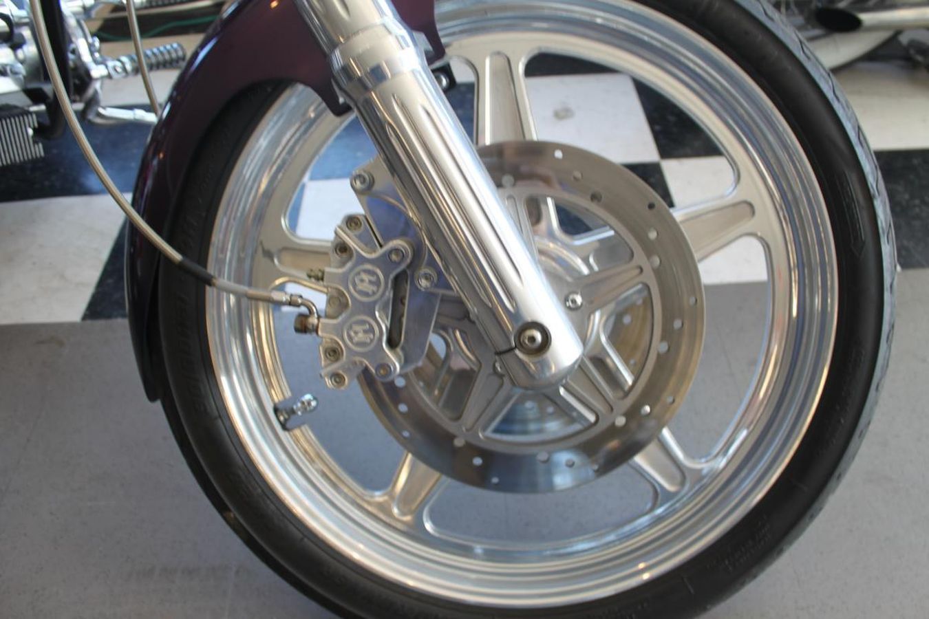 A close up of the front wheel of a motorcycle