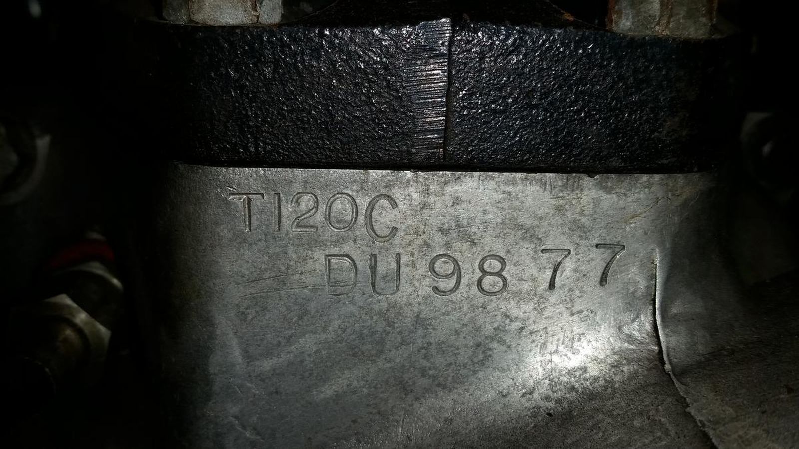 A close up of a metal object with a number on it.